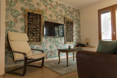 Télévision ou salle de divertissement dans l'établissement Gîte LE CLOS DES MIGRATEURS