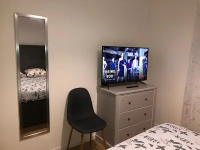 Télévision ou salle de divertissement dans l'établissement Apparemment 003
