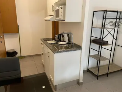 Cuisine ou kitchenette dans l'établissement Studio 005