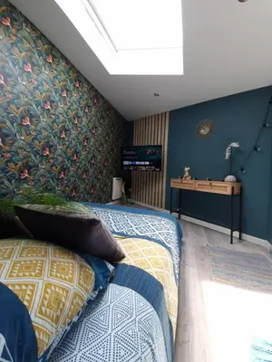 Un ou plusieurs lits dans un hébergement de l'établissement Studio Eden Jacuzzi