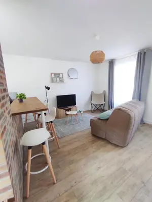 Coin salon dans l'établissement Les Nuits Bonneuilloises Le Percheron