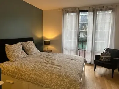 Un ou plusieurs lits dans un hébergement de l'établissement STUDIO PROCHE PARIS VERSAILLES