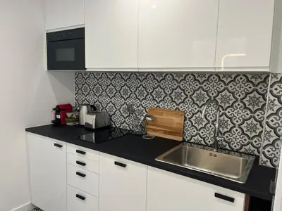 Cuisine ou kitchenette dans l'établissement STUDIO PROCHE PARIS VERSAILLES