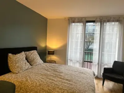 Un ou plusieurs lits dans un hébergement de l'établissement STUDIO PROCHE PARIS VERSAILLES