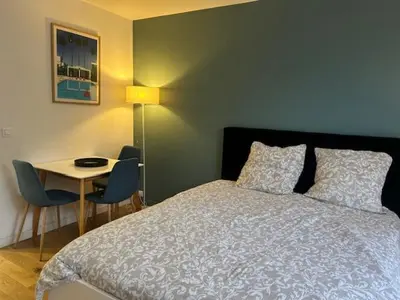 Un ou plusieurs lits dans un hébergement de l'établissement STUDIO PROCHE PARIS VERSAILLES