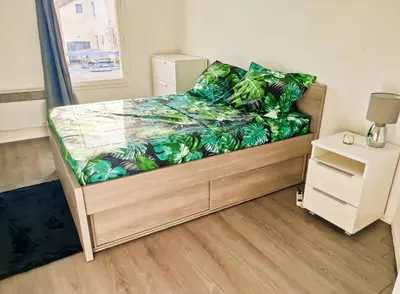Un ou plusieurs lits dans un hébergement de l'établissement CHARMANT APPARTEMENT SUR SOTTEVILLES LES ROUEN