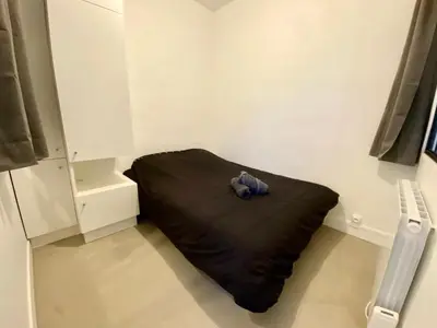 Un ou plusieurs lits dans un hébergement de l'établissement Henry I - petit appartement lumineux - 014