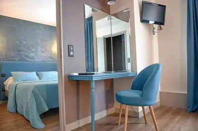 Un ou plusieurs lits dans un hébergement de l'établissement Auberge la Renaissance