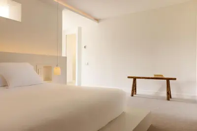 Un ou plusieurs lits dans un hébergement de l'établissement Ô PLUM'ART Chambres de caractère