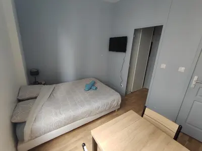 Un ou plusieurs lits dans un hébergement de l'établissement Studio cosy - Hypercentre - 20 min to Paris