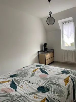 Un ou plusieurs lits dans un hébergement de l'établissement Agréable maison 3* en bord de mer