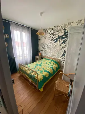 Un ou plusieurs lits dans un hébergement de l'établissement Chambre privée les Clottins dans maison