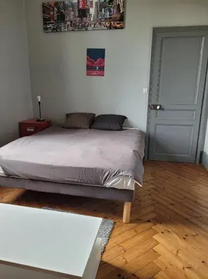 Un ou plusieurs lits dans un hébergement de l'établissement Chambre chez l'habitant 1