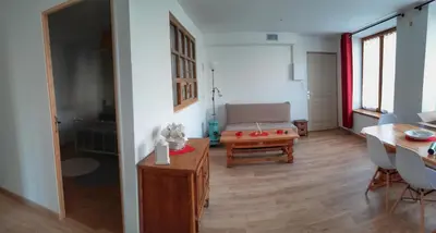 Coin salon dans l'établissement Ferme de Beaulieu, appartement avec jardin privatif