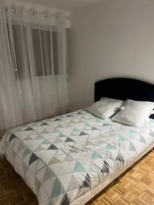 Un ou plusieurs lits dans un hébergement de l'établissement Spacieux et confortable appartement en résidence