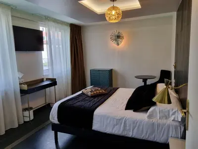 Un ou plusieurs lits dans un hébergement de l'établissement Hôtel d'Angleterre Rouen Centre Gare
