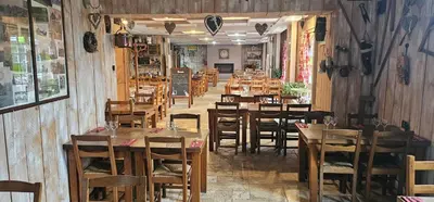Restaurant ou autre lieu de restauration dans l'établissement Gite mes pt'tis lits maison chaleureuse 4 chambres