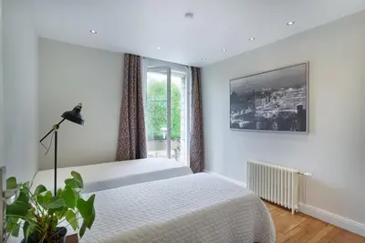 Un ou plusieurs lits dans un hébergement de l'établissement Les appartements de Chantilly - gare