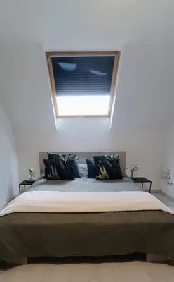 Un ou plusieurs lits dans un hébergement de l'établissement Agréable chambre double avec salle d'eau privative
