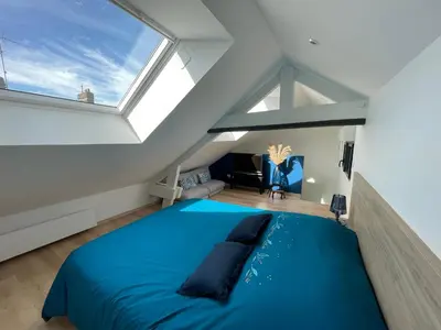 Un ou plusieurs lits dans un hébergement de l'établissement Appartement Les Jardins de Jules Verne - Côté Mer