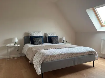 Un ou plusieurs lits dans un hébergement de l'établissement Maison cosy entre Paris Rouen et Deauville