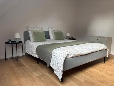 Un ou plusieurs lits dans un hébergement de l'établissement Maison cosy entre Paris Rouen et Deauville