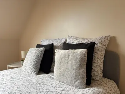 Un ou plusieurs lits dans un hébergement de l'établissement Maison cosy entre Paris Rouen et Deauville
