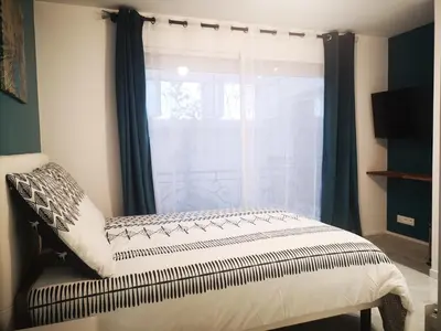 Un ou plusieurs lits dans un hébergement de l'établissement STUDIO COSY HYPER CENTRE GARE AMIENS WIFI NETFLIX 2 PERS