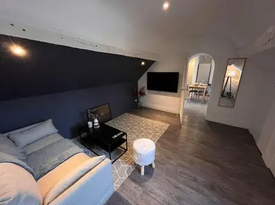 Coin salon dans l'établissement Appartement avec terrasse en plein cœur de Vernon