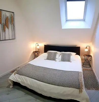 Un ou plusieurs lits dans un hébergement de l'établissement Nalan Johannisien, Maison piscine chauffée-Spa, Paris CDG-Disney