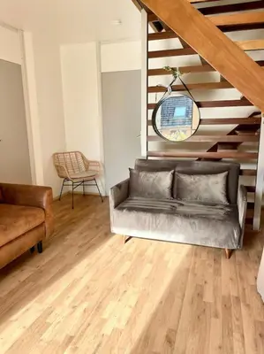 Coin salon dans l'établissement Vive la vie - maison de famille à Mers proche mer