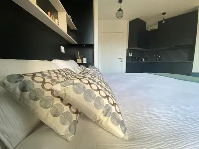 Un ou plusieurs lits dans un hébergement de l'établissement Au Studio Pissarro