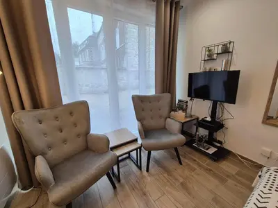 Télévision ou salle de divertissement dans l'établissement La Mad Experience