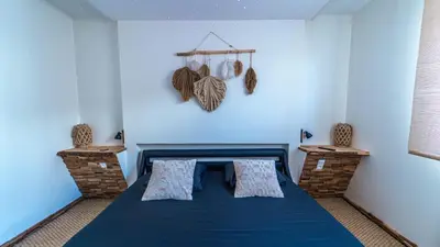 Un ou plusieurs lits dans un hébergement de l'établissement Wood 47 spa