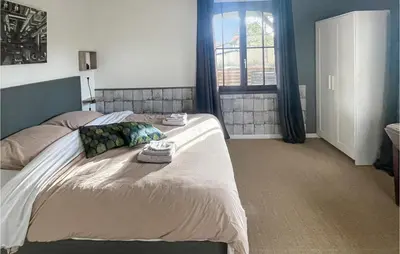 Un ou plusieurs lits dans un hébergement de l'établissement Cozy Home In Bray-Lès-Mareuil