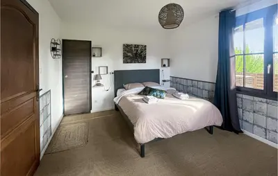 Un ou plusieurs lits dans un hébergement de l'établissement Cozy Home In Bray-Lès-Mareuil
