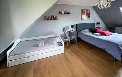 Un ou plusieurs lits dans un hébergement de l'établissement Cozy Home In Bray-Lès-Mareuil