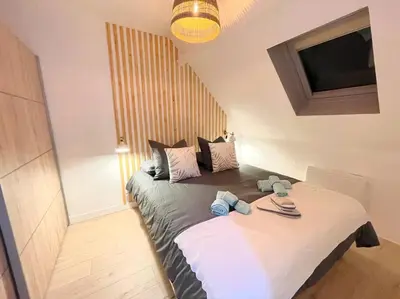 Un ou plusieurs lits dans un hébergement de l'établissement La Suite ALOHA, Elegant & Cosy