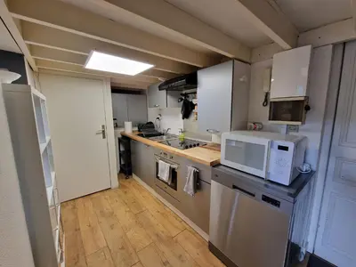 Cuisine ou kitchenette dans l'établissement Le Fontenelle Appartement hyper centre par beds76
