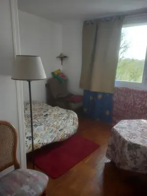 Un ou plusieurs lits dans un hébergement de l'établissement Spacieux appartement 4 pieces