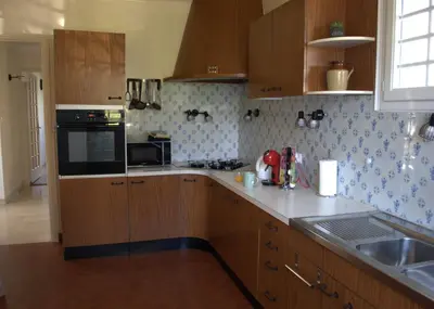 Cuisine ou kitchenette dans l'établissement La Bergerie