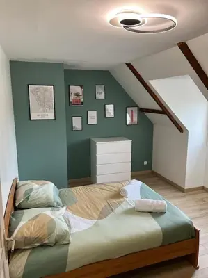 Un ou plusieurs lits dans un hébergement de l'établissement Villa avec piscine chauffée à moins 1h30 de Paris
