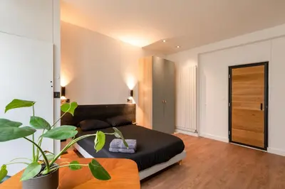 Coin salon dans l'établissement Appartement Le Médicis - 2 chambres