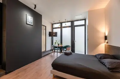 Un ou plusieurs lits dans un hébergement de l'établissement Appartement Le Médicis - 2 chambres