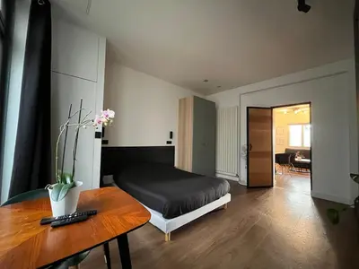 Un ou plusieurs lits dans un hébergement de l'établissement Appartement Le Médicis - 2 chambres