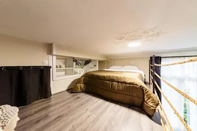 Un ou plusieurs lits dans un hébergement de l'établissement Le Château Senard, Studio cosy 23 m2 au calme proche gare - 3 min