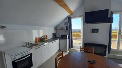 Cuisine ou kitchenette dans l'établissement L'appel de la foret
