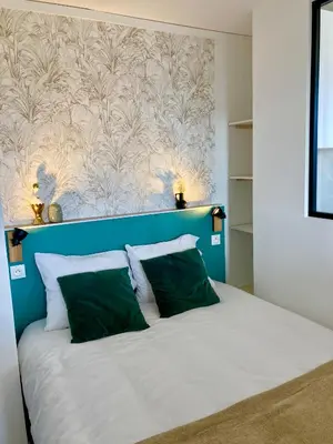 Un ou plusieurs lits dans un hébergement de l'établissement La Belle Vue Appartement 2 personnes Vue port