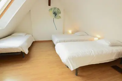 Un ou plusieurs lits dans un hébergement de l'établissement l'Inattendue Maison avec Jardin