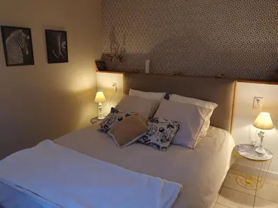 Un ou plusieurs lits dans un hébergement de l'établissement La Villa Juliette L'Etoile Filante Gite